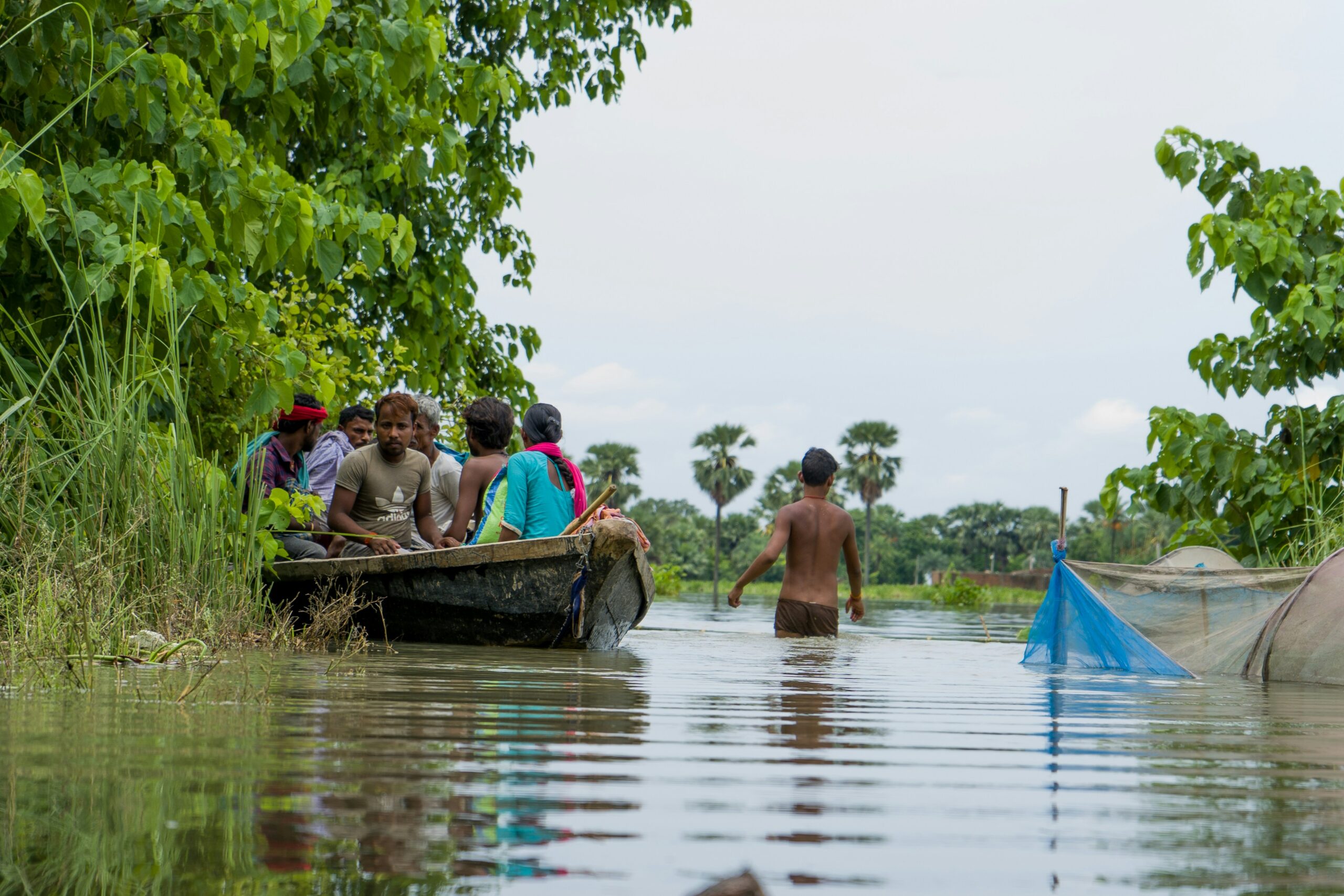 a group of people in a boat on a river