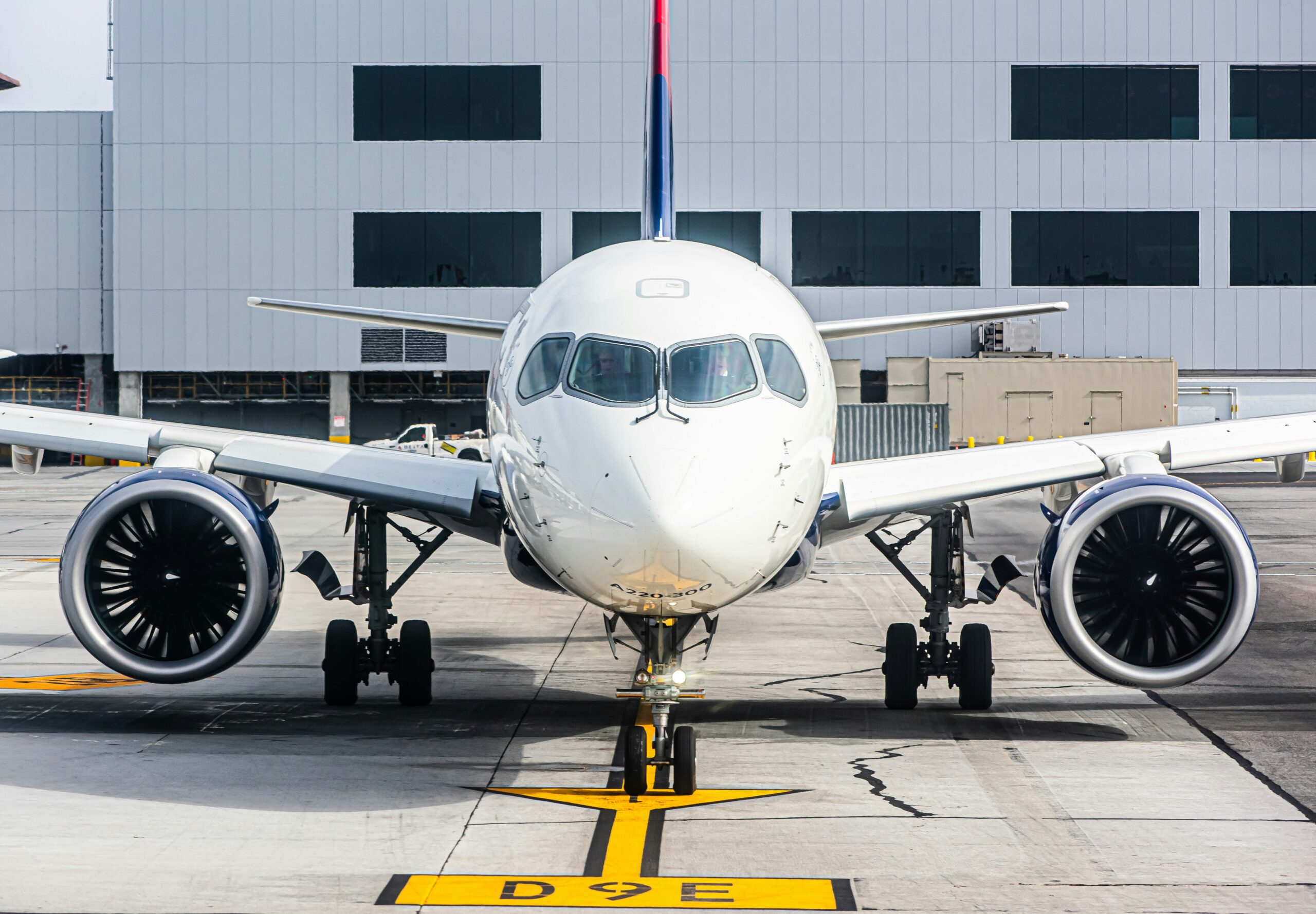 a large jetliner sitting on top of an airport tarmac