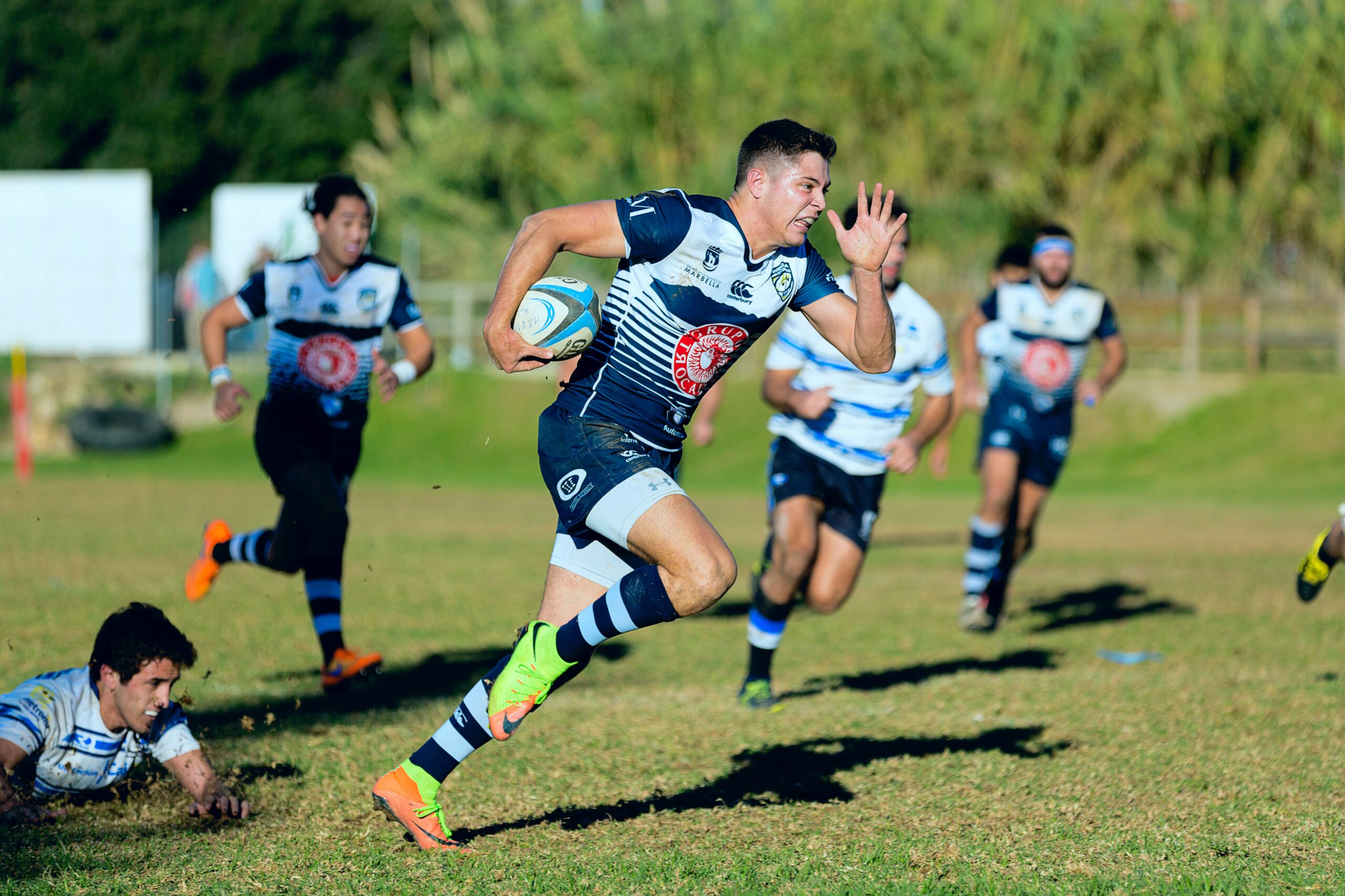 team playing rugby sport