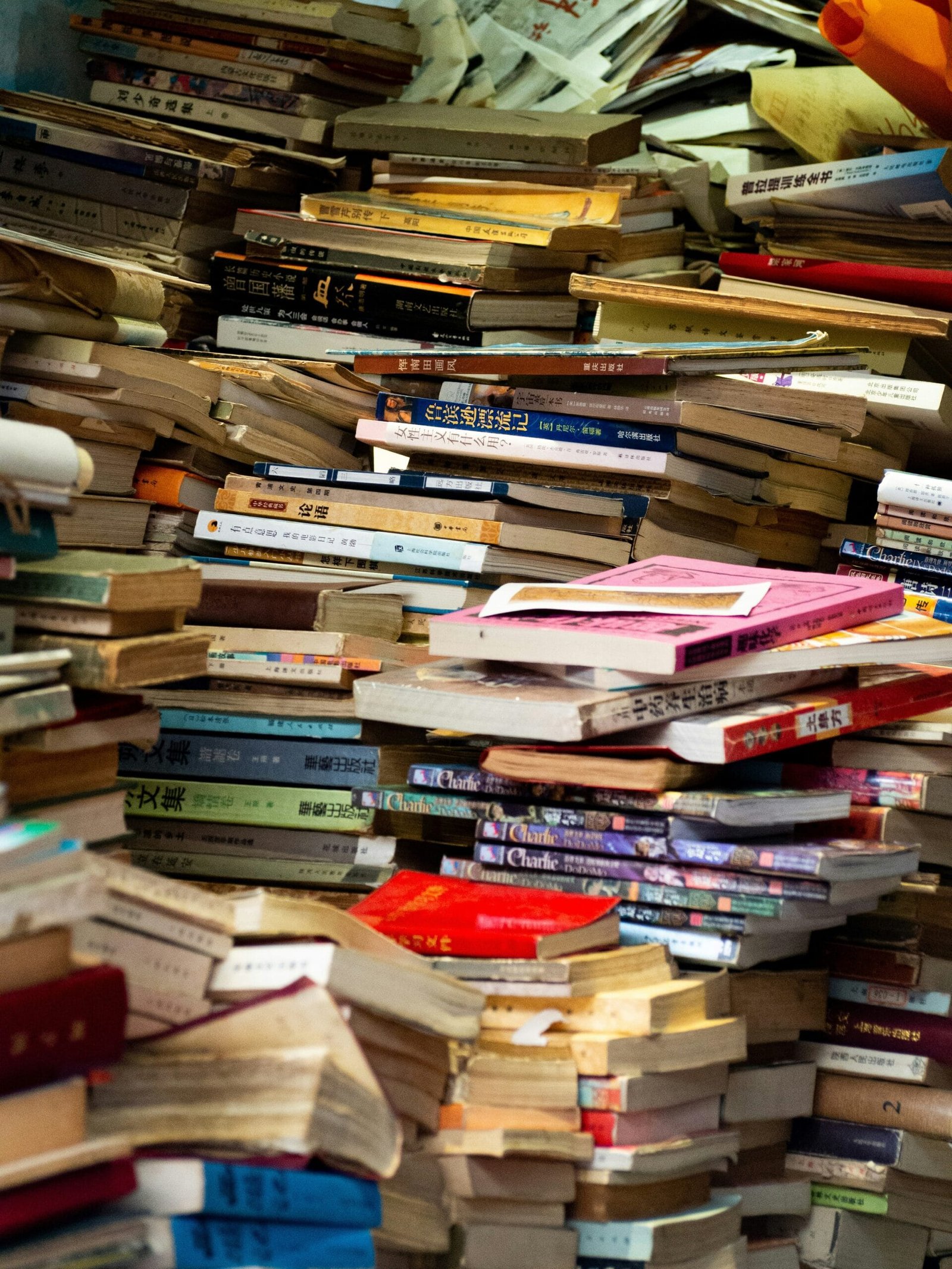 A pile of books sitting on top of a table