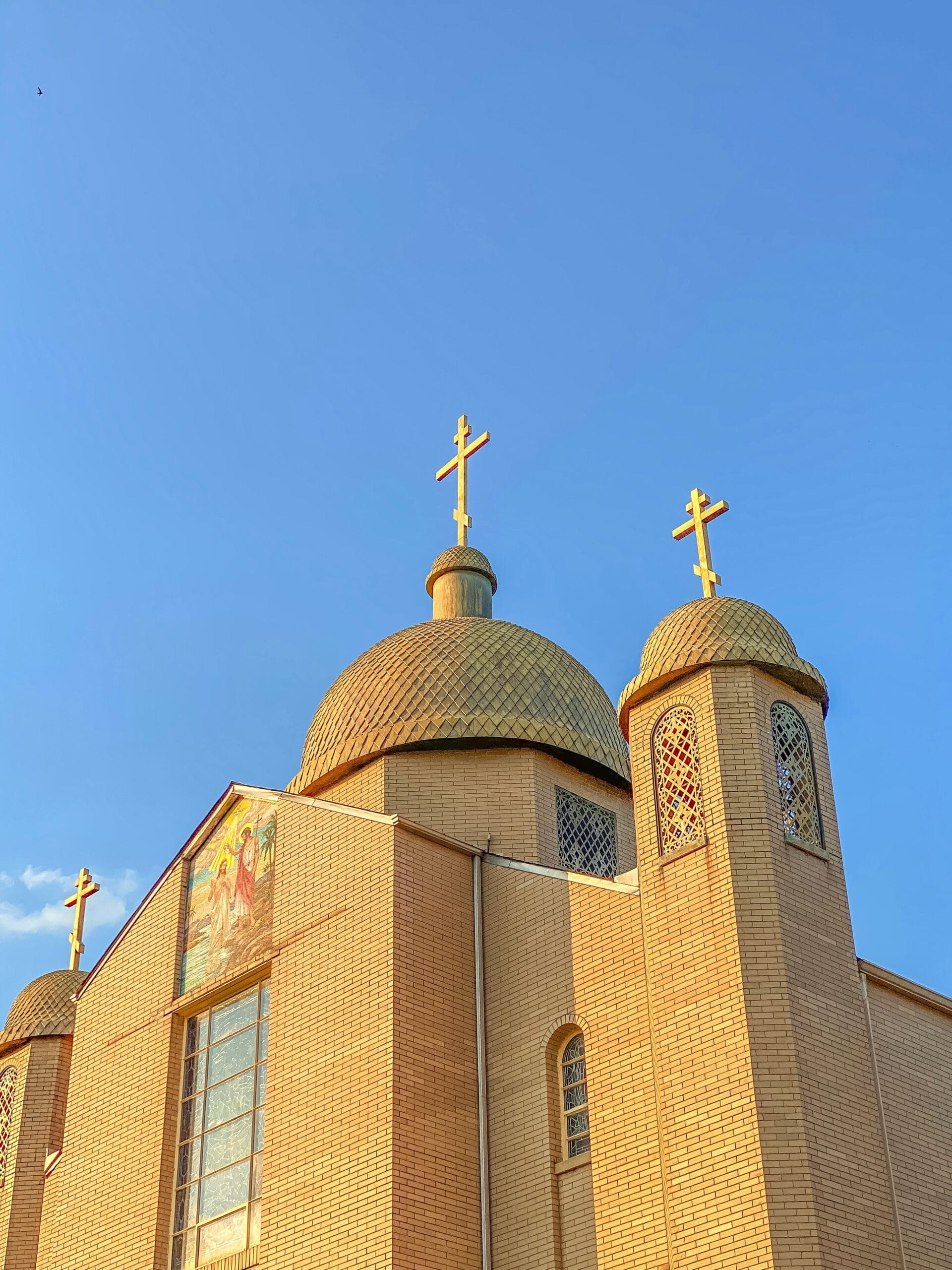 a church with a cross on the top of it