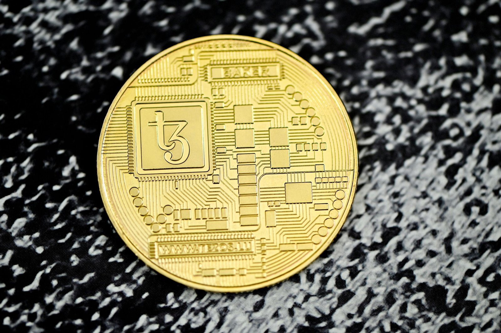 Generational Shifts: How Millennials and Gen Z are Driving Bitcoin Adoption 2 a close up of a coin on a black surface