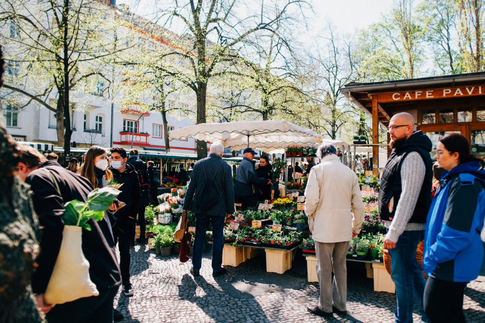 a group of people standing around a market