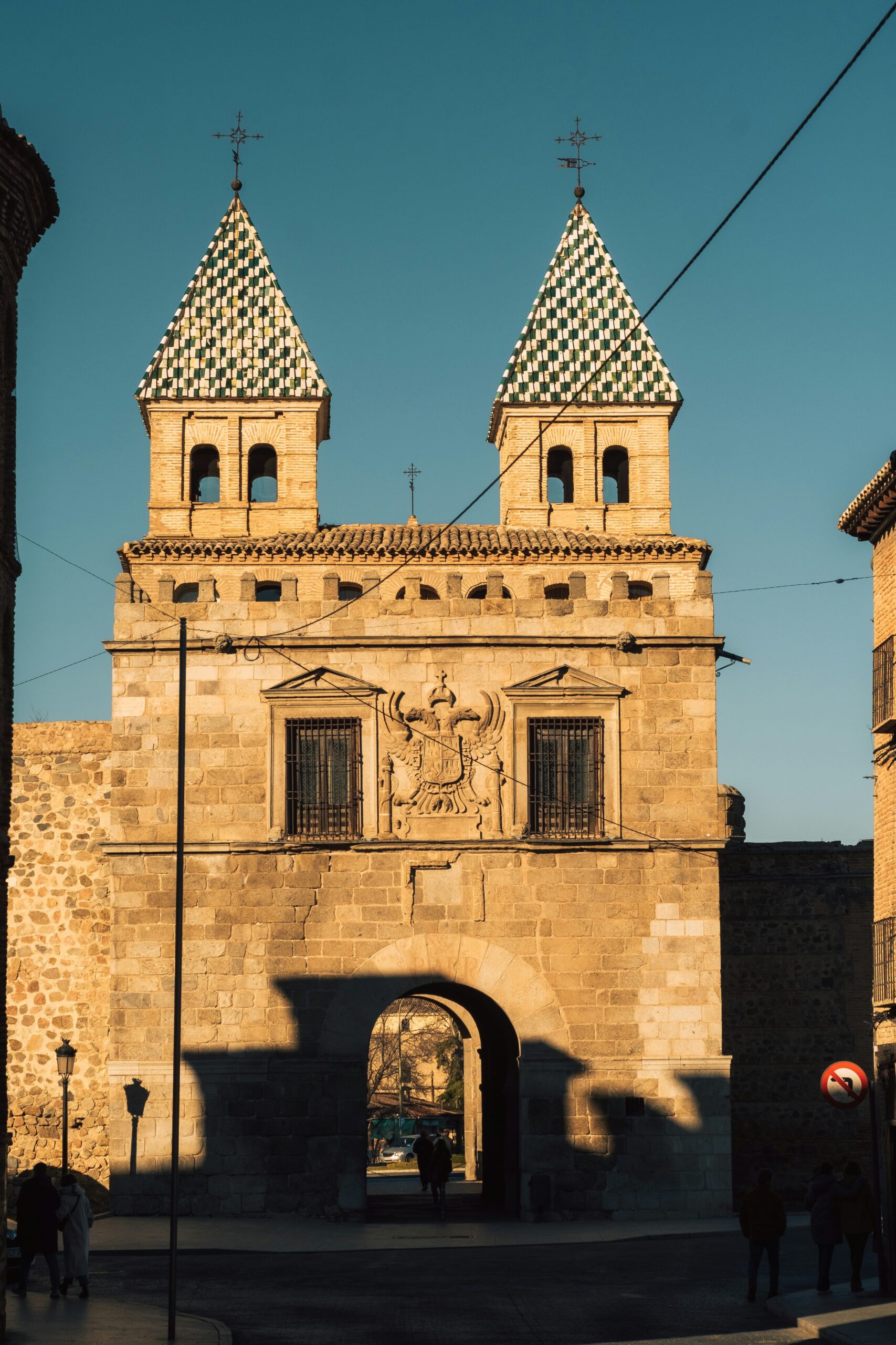 a large building with two towers and a clock on it