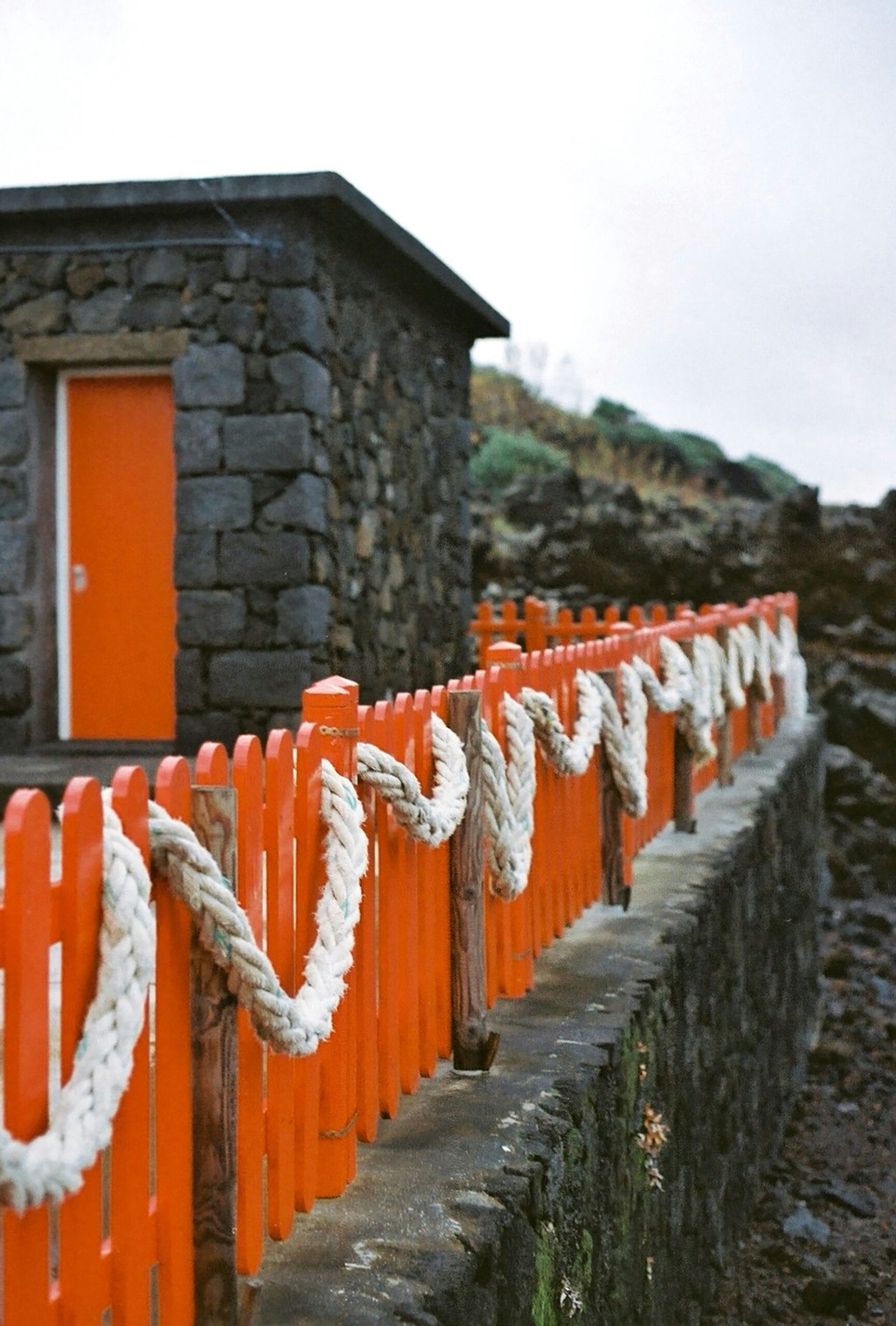 The Role of Cultural Heritage in Shaping National Identity 33 a row of orange and white ropes next to a building