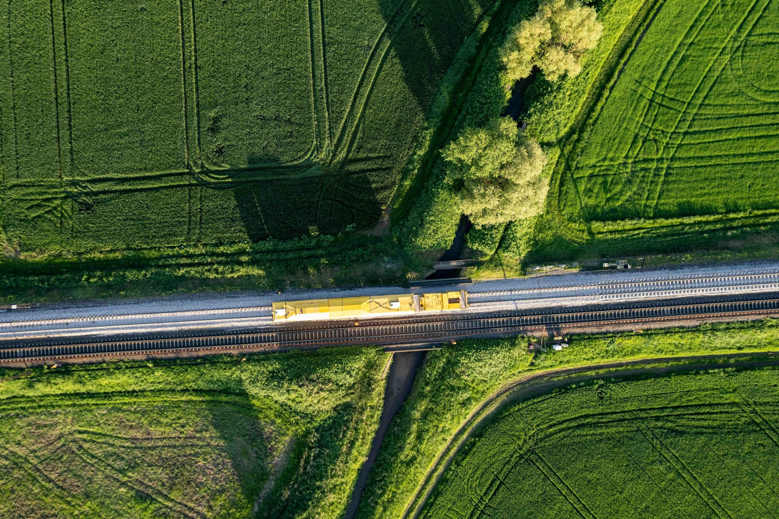 a train traveling through a lush green countryside