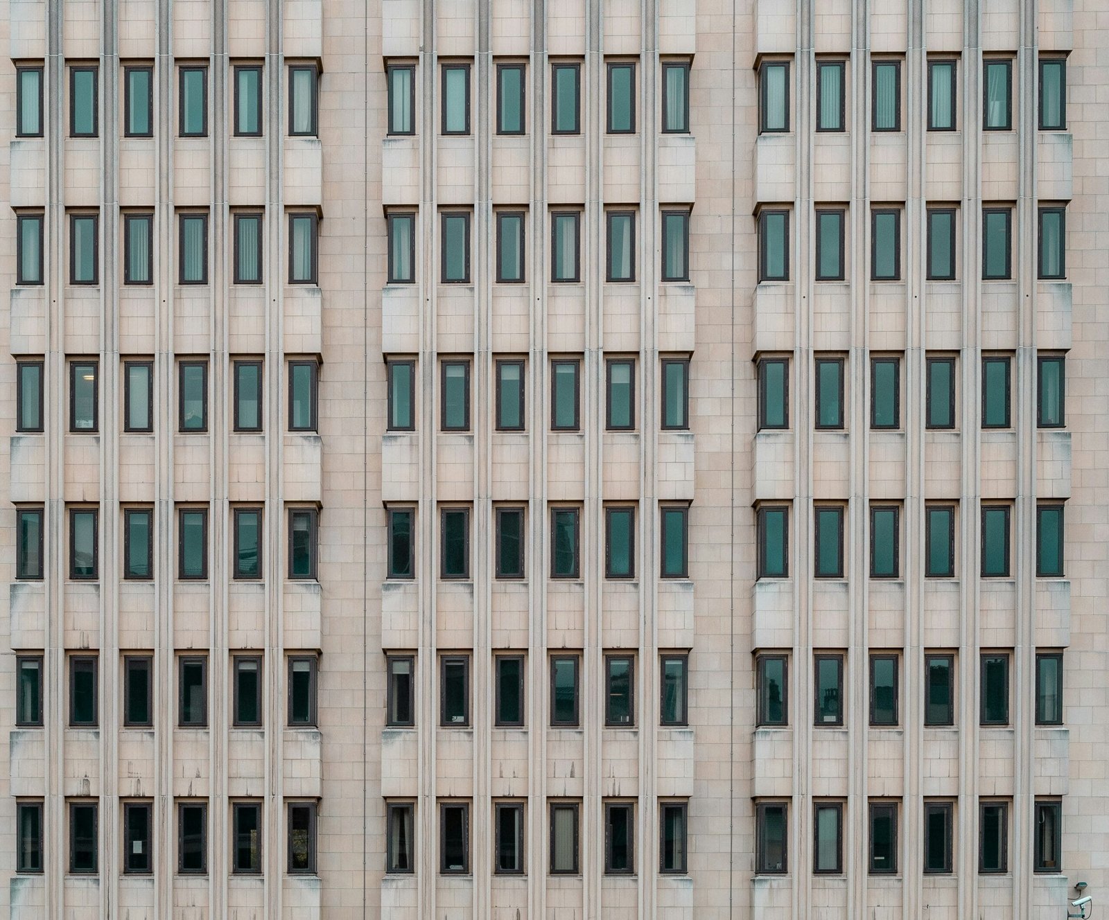 Dismantling the Regulatory Framework: A Path to Market Liberation and Economic Efficiency 2 gray concrete building during daytime