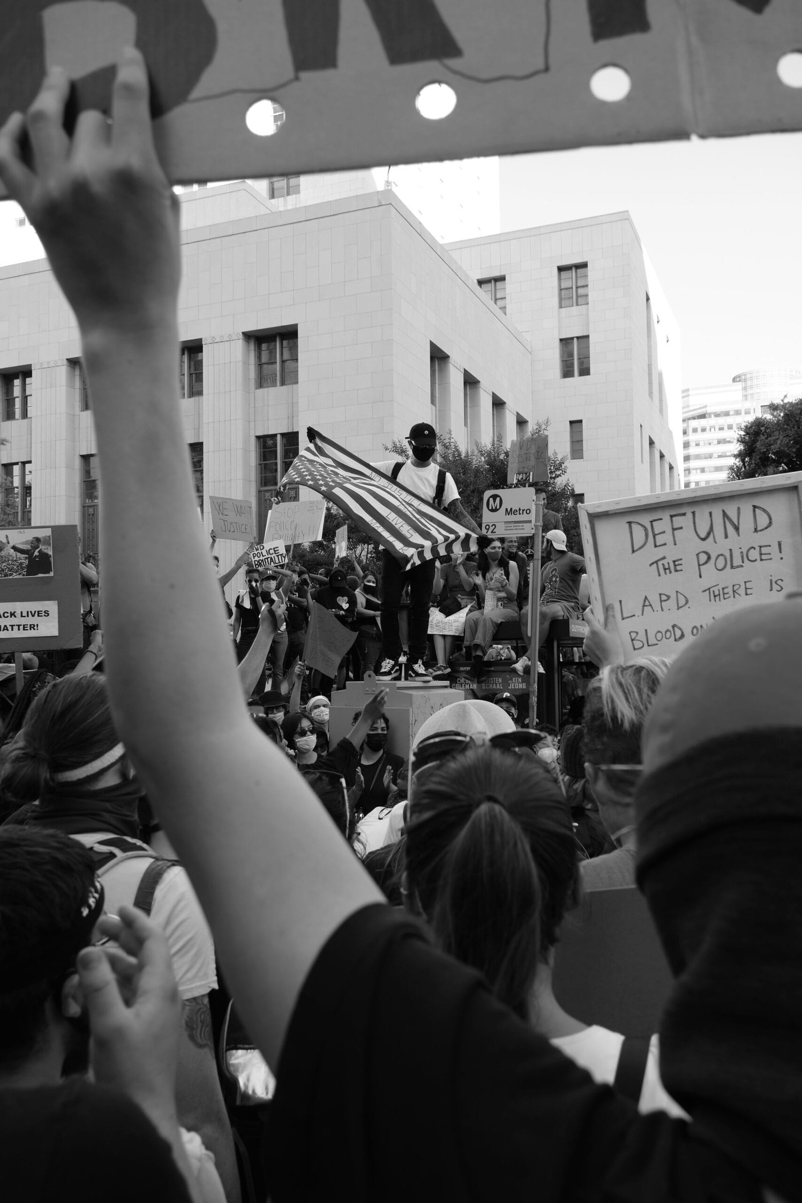 grayscale photo of people in the street