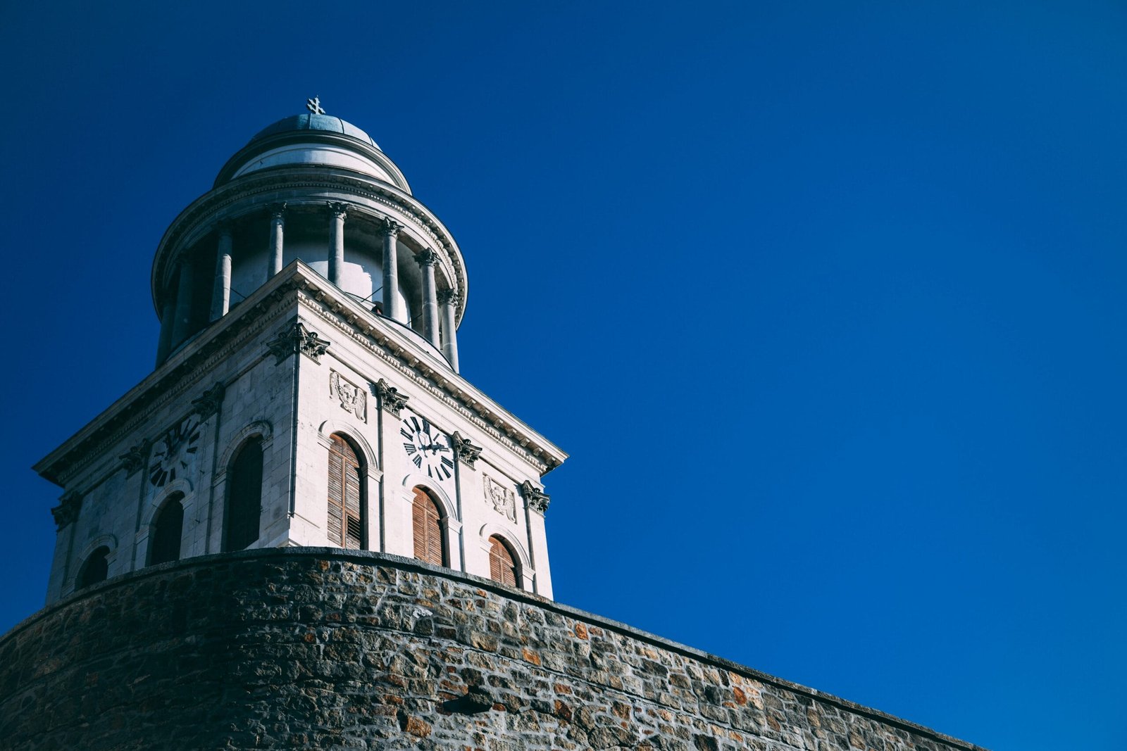 low-angle photo of white and brown cathedral