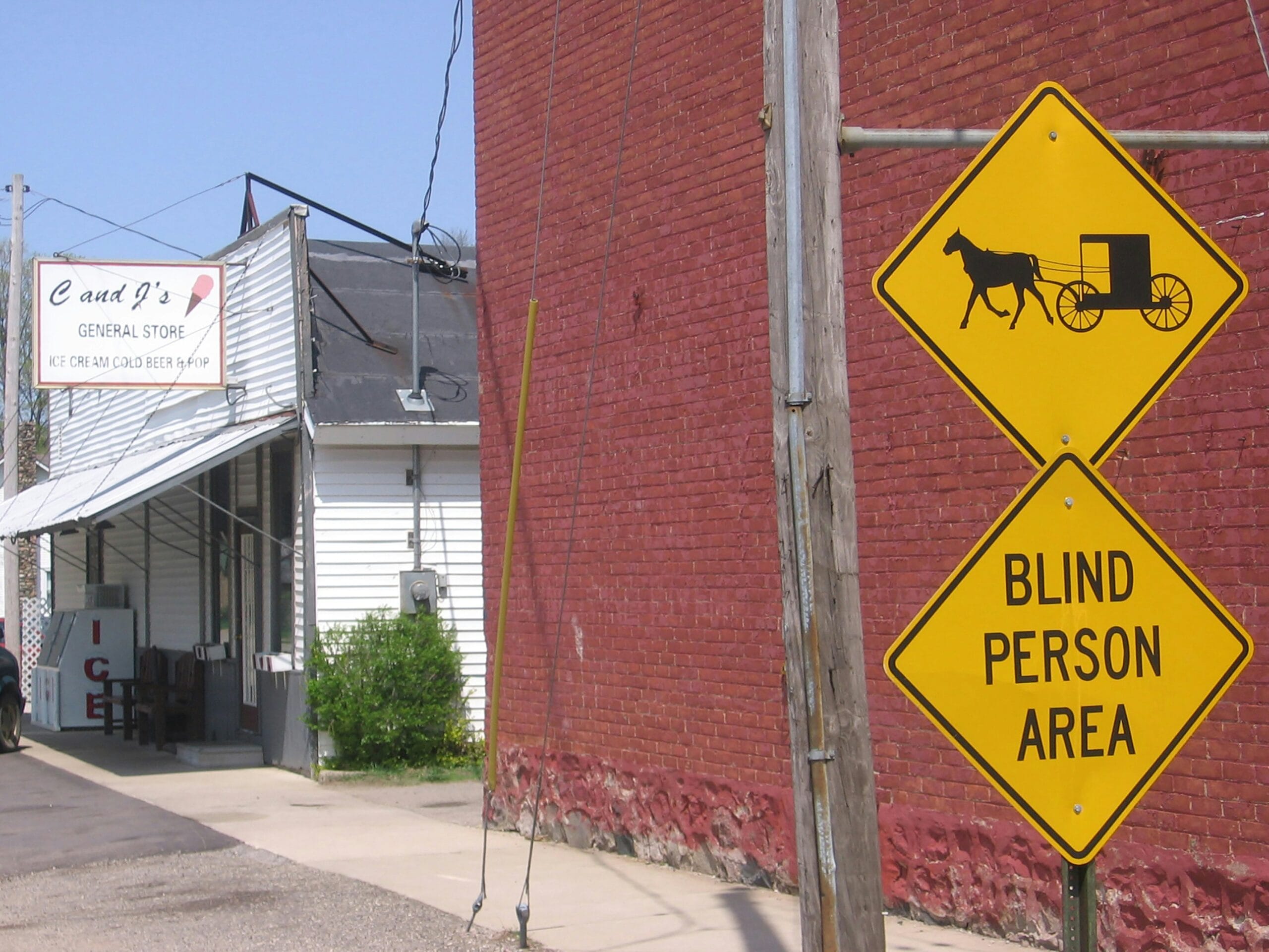 yellow and black road sign