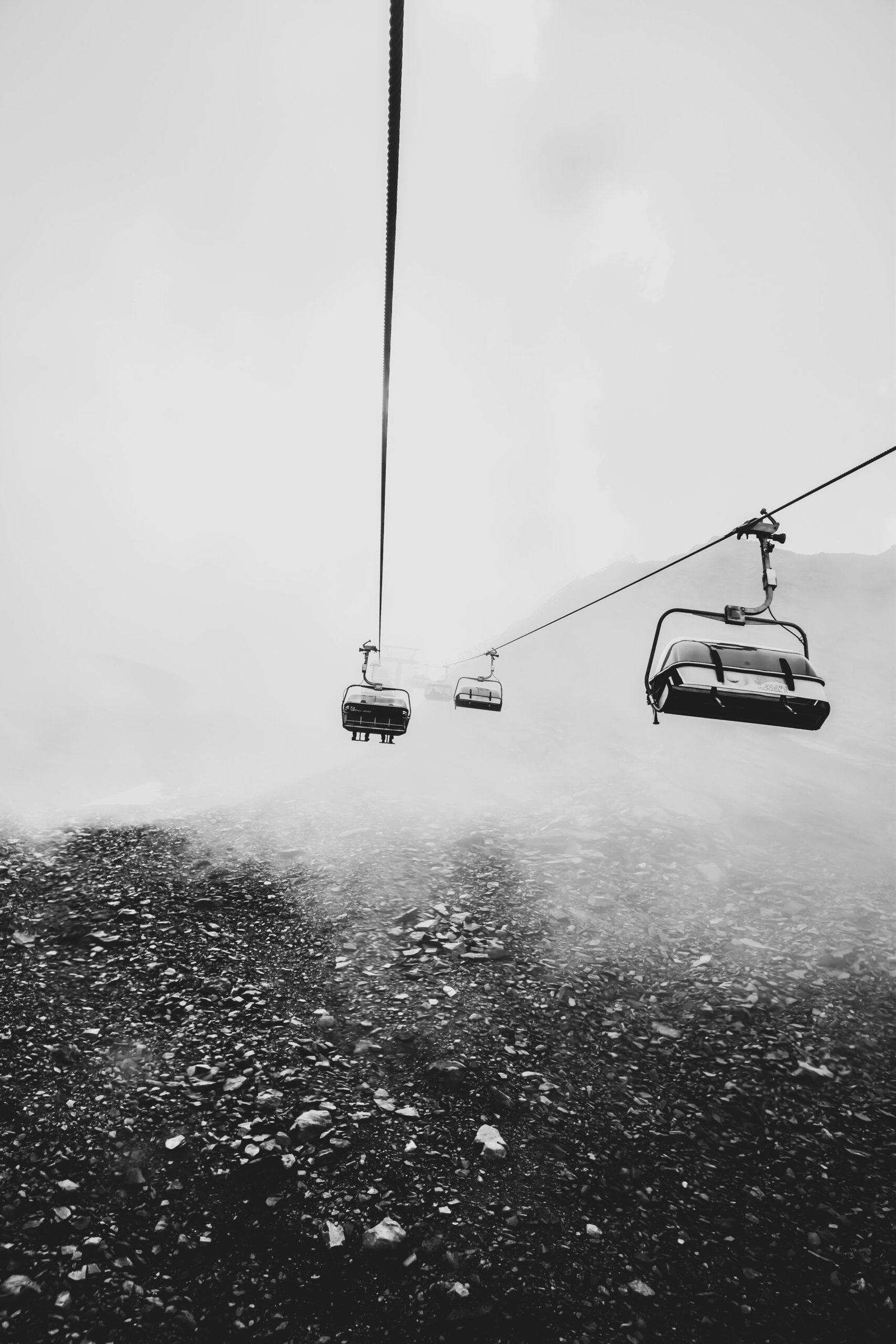 grayscale photography of cable cars